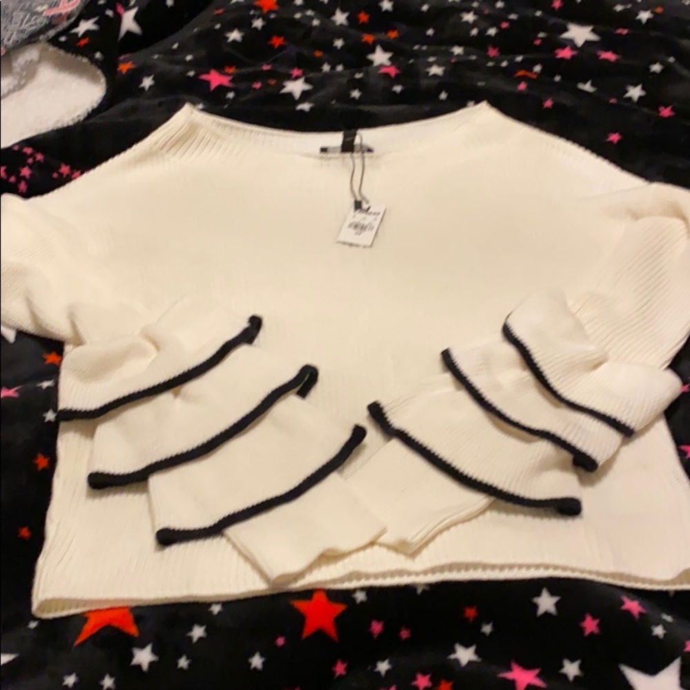 Cream sweater with ruffle sleeves